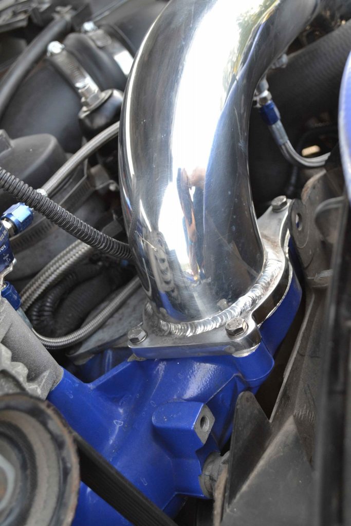 To increase airflow and add some cosmetic style, a No Limit Fabrication cold-side intake pipe was installed.