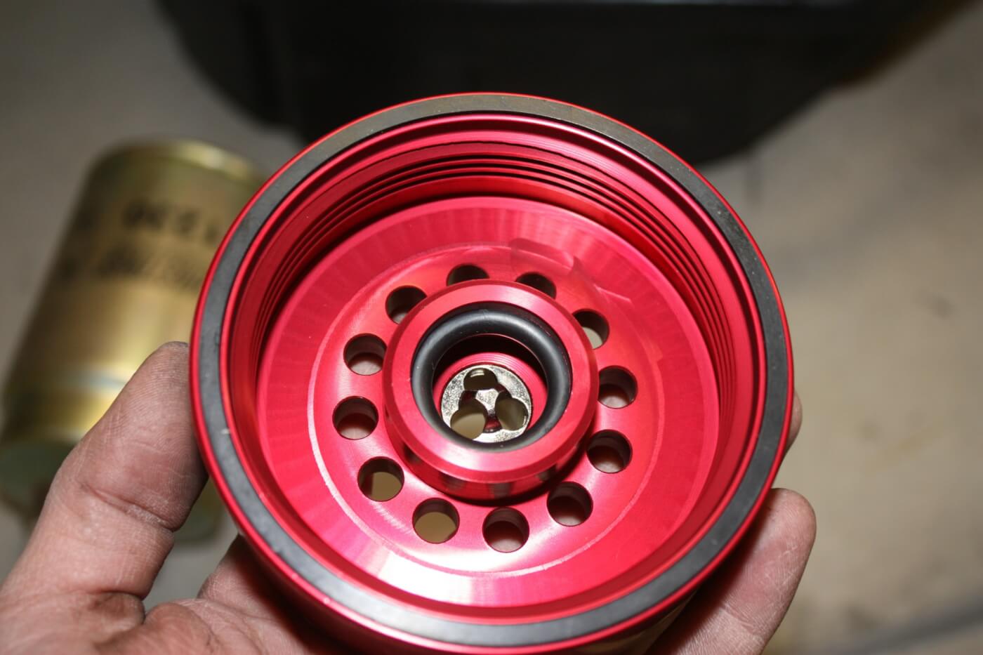 The custom-machined Adaptor has the same internal threads as a stock fuel filter, so it simply threads right onto the factory base. While the bottom side of the filter has a machined external thread to accept the new Cat spin-on filter. Once the Adaptor is installed, it can remain in place for all future services; you’ll just need to swap the filter itself.