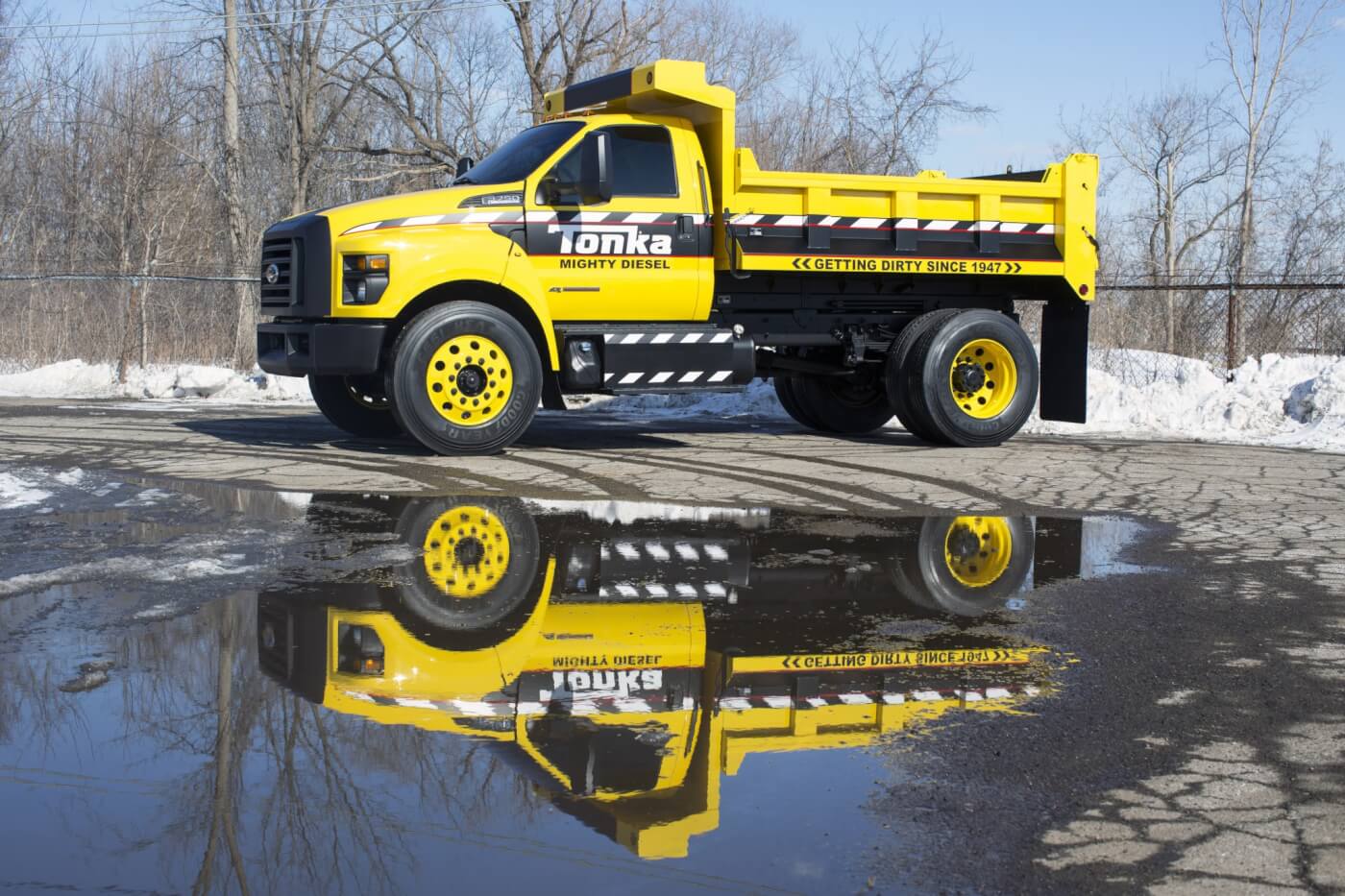 Based on the all-new 2016 Ford F-650/F-750, the Mighty F-750 TONKA dump truck is is painted signature TONKA yellow with a custom blackout nostril grille and fully functional dump body from Truck Tech Engineers.