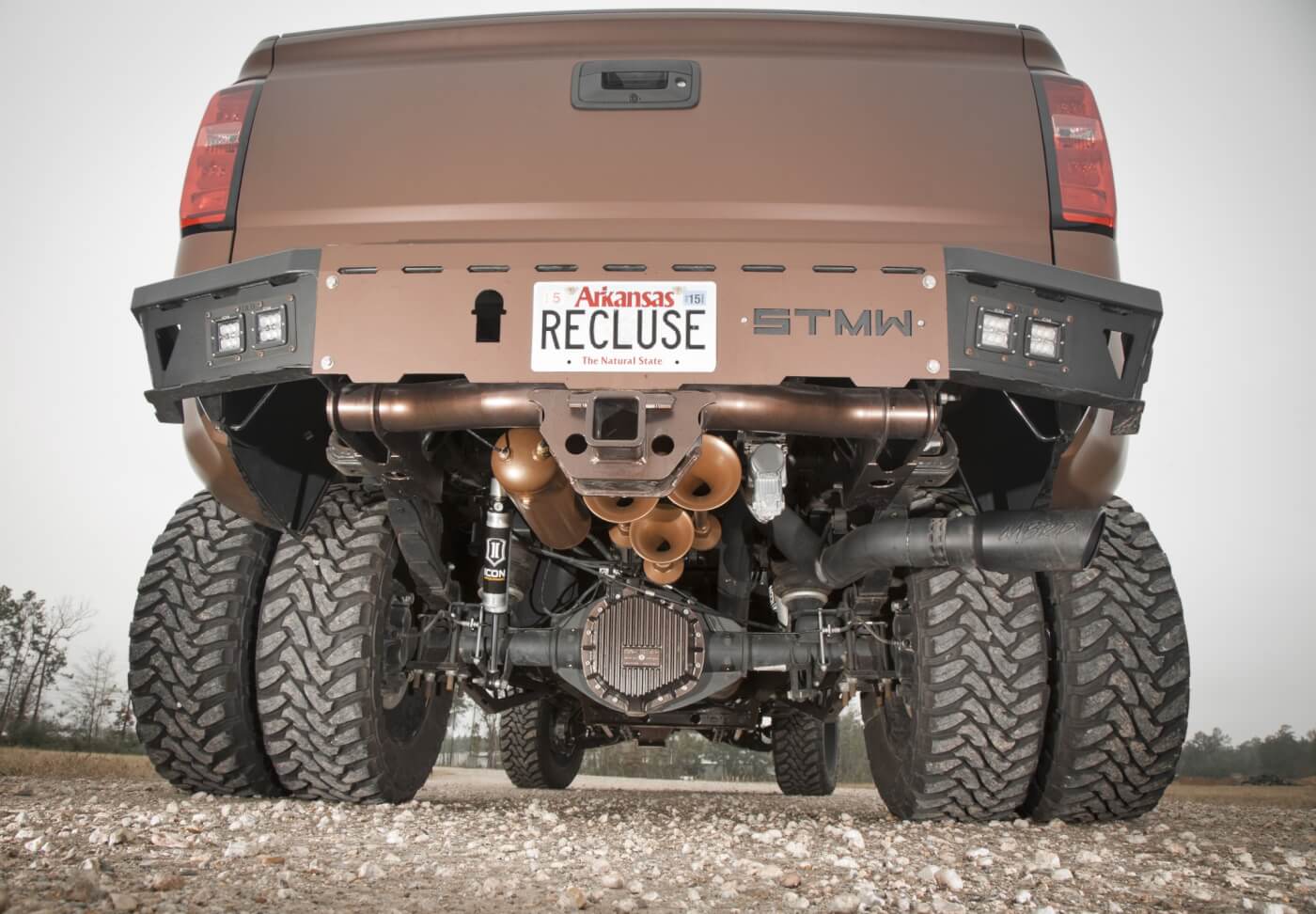 Under the rear of the truck, a set of 5-inch lift leaf springs from Atlas complements the McGaughys front suspension. As with the front, Icon Vehicle Dynamic¬¬ shocks are used. A set of Firestone air bags helps keep the truck level, even with a full load. To feed the air bags and HornBlasters air horns, a Viair compressor system was also installed. The final upgrade under the bumper is the Mag-Hytec differential cover. Regarding the bumper, it’s from ShowTime Metal Works. It works with the rear receiver hitch and sports two pairs of OLB LED lights on each corner.