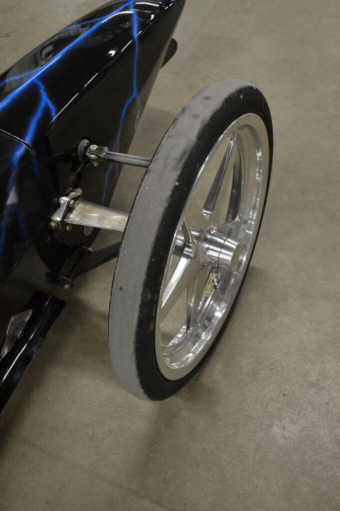Goodyear Eagle Top Fuel Frontrunner tires are mounted on Weld wheels on the front of the dragster and can survive 300mph blasts. On this type of application, the entire chassis flexes enough to provide slight dampening, so no front or rear suspension is used.