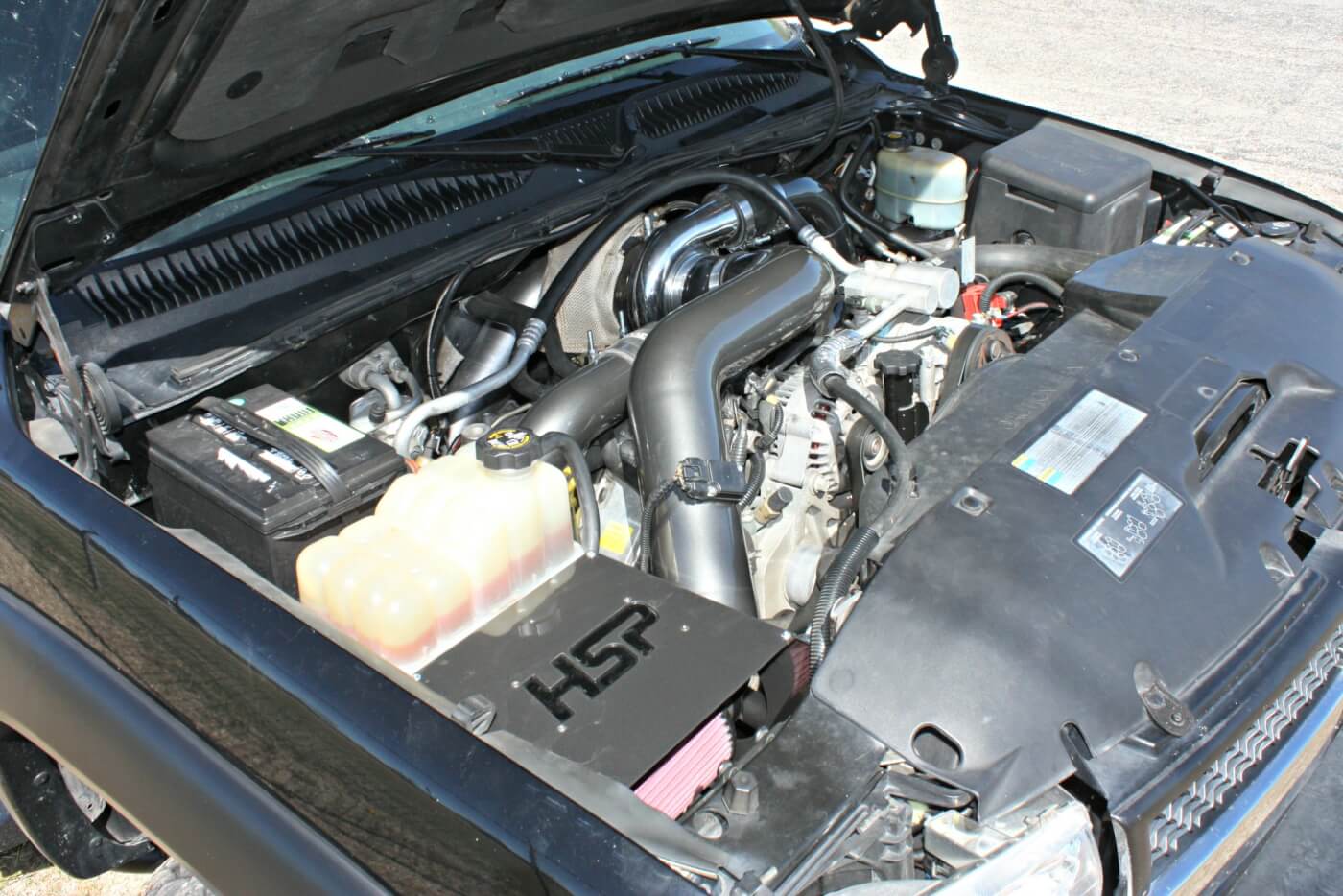 HSP Diesel S300 Turbo System, paired with a High Tech Turbo S365 FMW turbocharger, is a great upgrade to replace the stock Duramax turbo. It offers quick spool-up and enough air to support 600-plus horsepower. In addition, the mandrel-bent piping and high-flow Y-bridge improves engine efficiency and is powdercoated to really add "bling" factor under the hood.