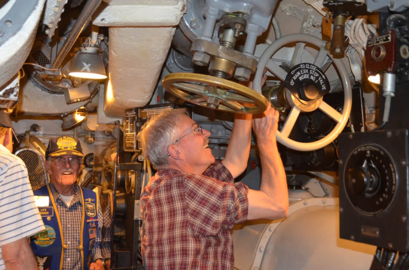  Charles Butcher, Chief of the Boat, opening the exhaust valve prior to starting the motor