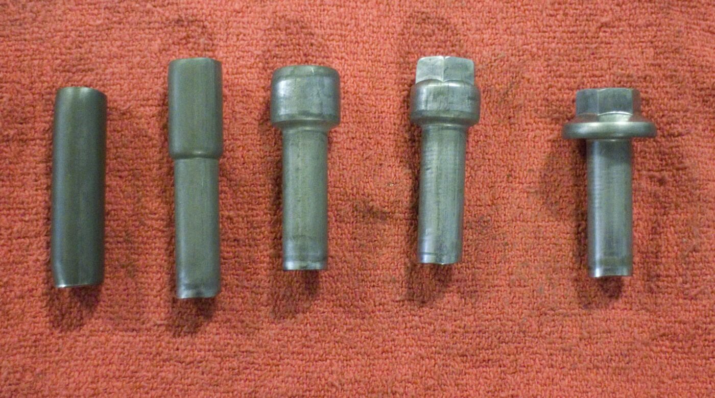 The cold heading process takes coil wire (L) and forms it into a basic bolt head (R). Four stations are needed to get the coil wire into the necessary form for the bolt making process.
