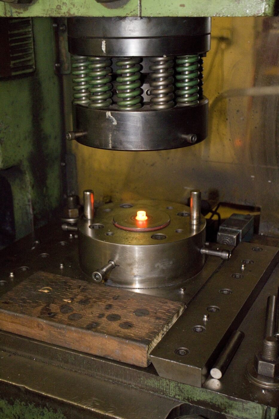 Hot heading involves heating the steel blanks to a precise, red-hot temperature and then putting tons of pressure to form the heads. This process is used for more complicated bolt head designs.