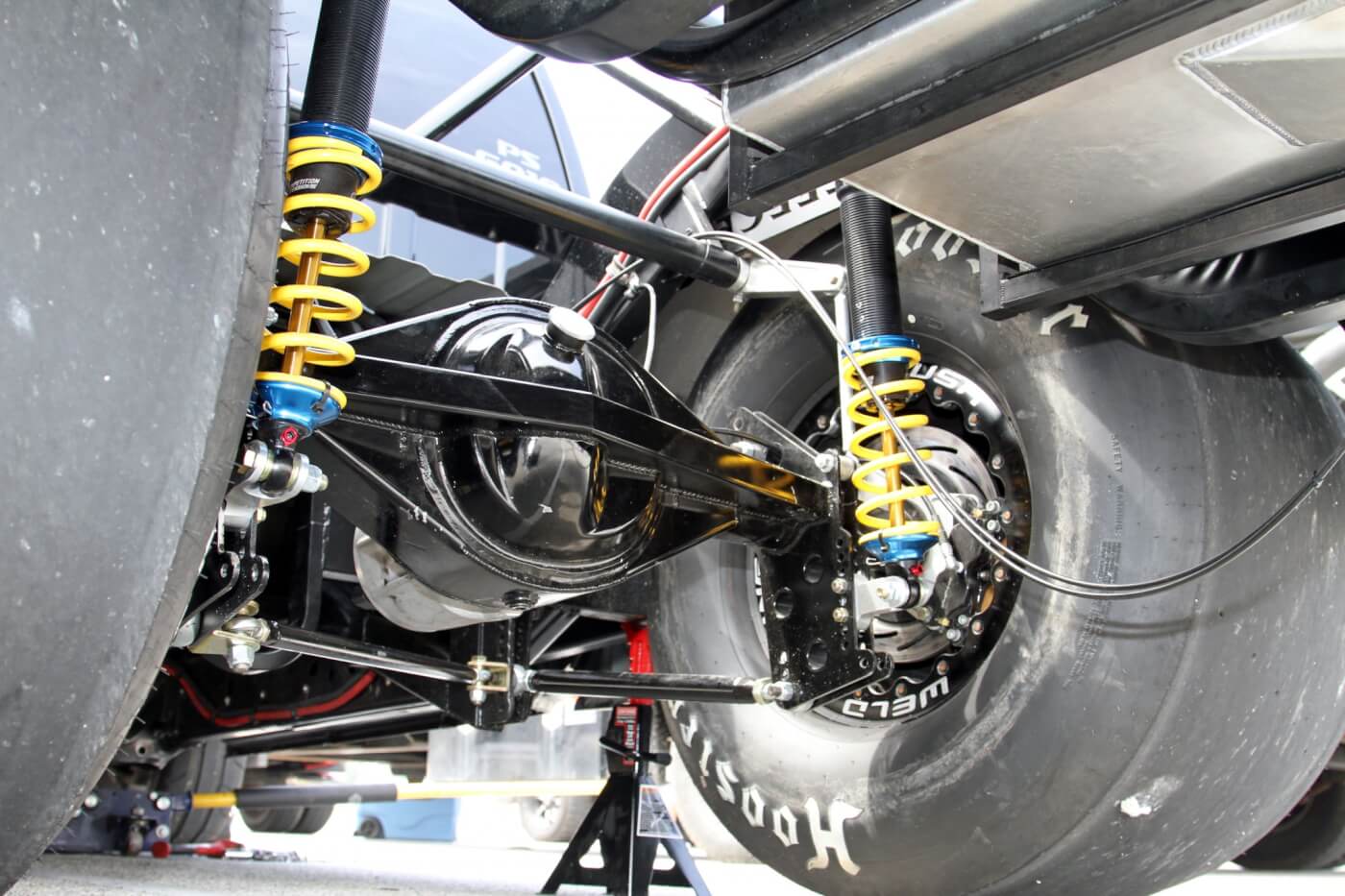 The new frame rails and 4-link suspension were installed to make room for these huge Hoosier drag slicks that are necessary to put the power to the track. Notice the Strange Engineering Pro-Race 9.5 rear axle and Competition Suspension coil over shocks: this truck is built for one purpose—to go fast.