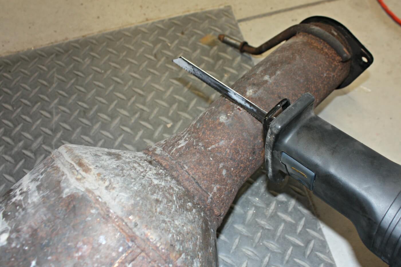 7. The Banks Monster Exhaust will retain the factory catalytic converter, however, one end will need to be cut off to make an easier and higher-flowing connection point to the rest of the 4” system.