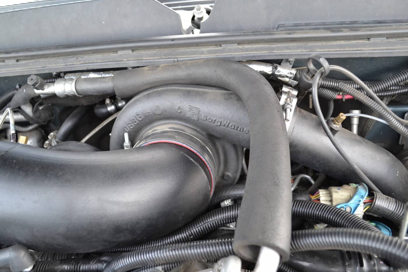 With trucks that have their turbochargers in the middle of the engine valley, firewall and hood clearance can become an issue. The S475 turbo (S400 frame, 75mm inducer) is a tight fit in this Duramax-powered GM.