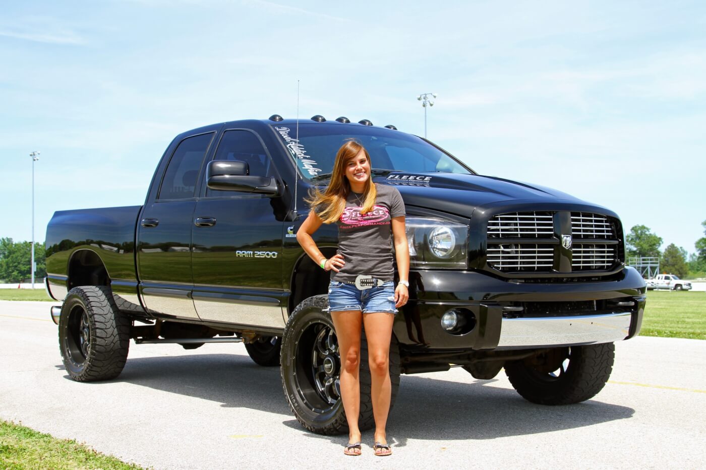 Trisha Finke stands proud with her 800-HP daily-driver Dodge Ram!