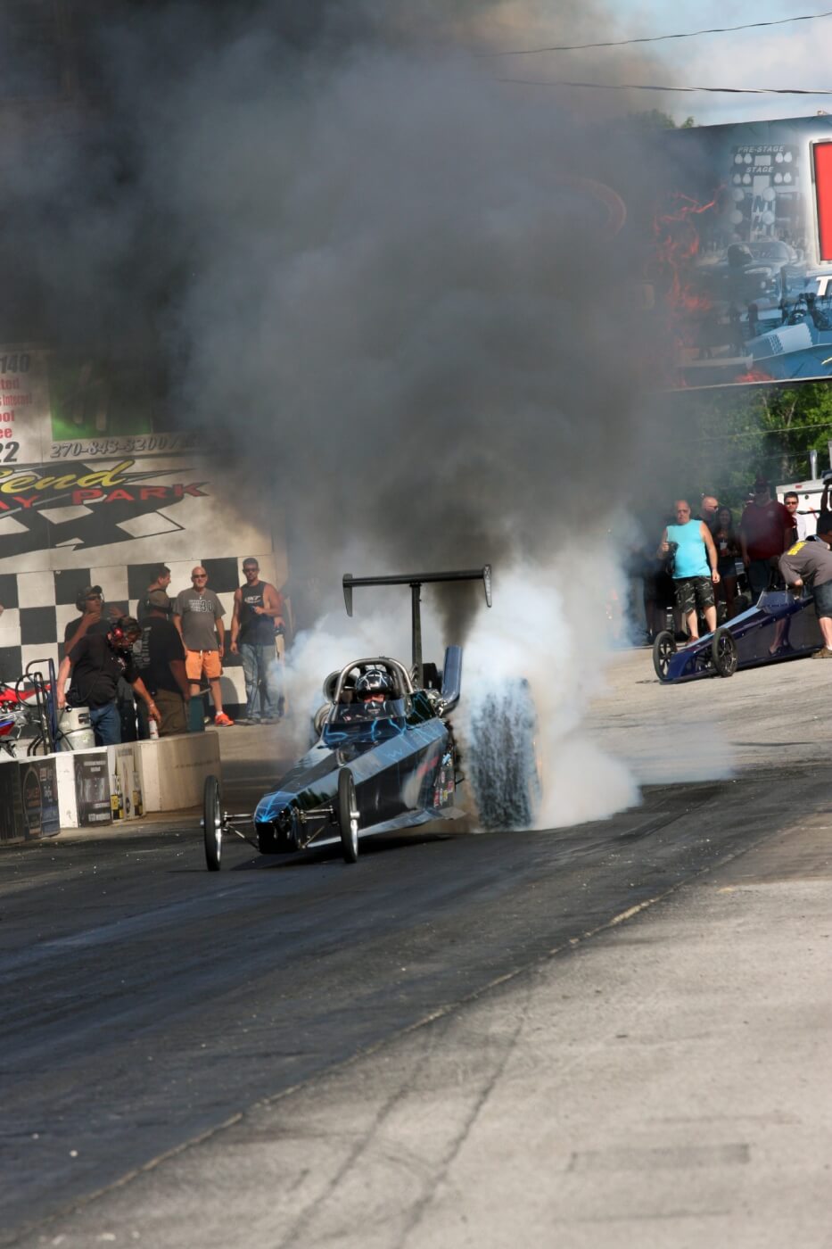 Jared Jones heats up the tires before making a pass in the Scheid Diesel dragster. He went over 200 mph while flying down the track.