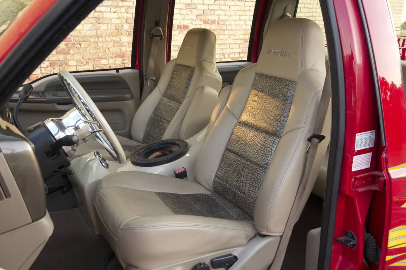 A clean and classy interior is made up of custom Katzkin with alligator inserts, complete Digital Designs audio and a few Billet Specialties pieces to round out the quality cabin.