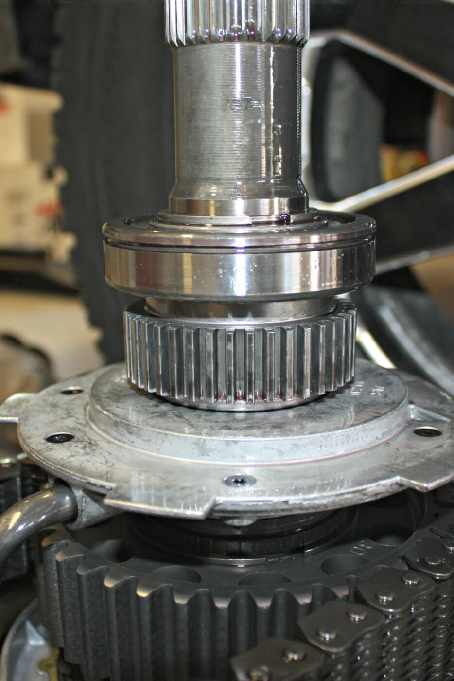 17. Pay attention to the stack-up position of the snap ring, bearing and gear as their positioning will need to be identical when it goes back together. The groove in the bearing will need to face rearward, as this is where the rear case snap ring will seat to hold everything together.