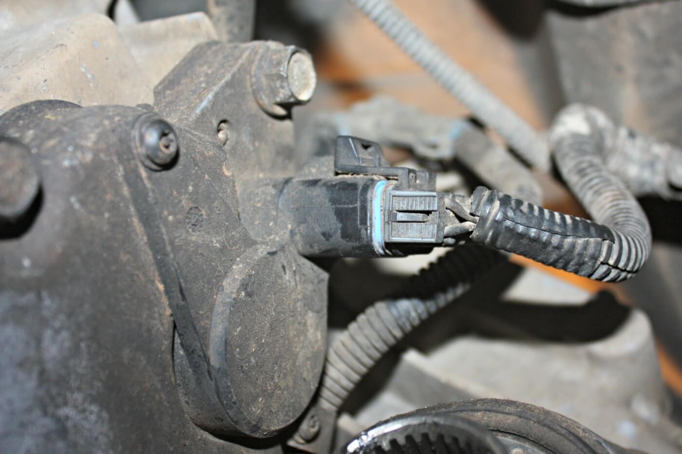 6. The next step in the removal process is to disconnect all the electronics, like this one shown plugged into the electronic shift selector. There are also a couple cables that are mounted to the transfer case that will need to be removed.