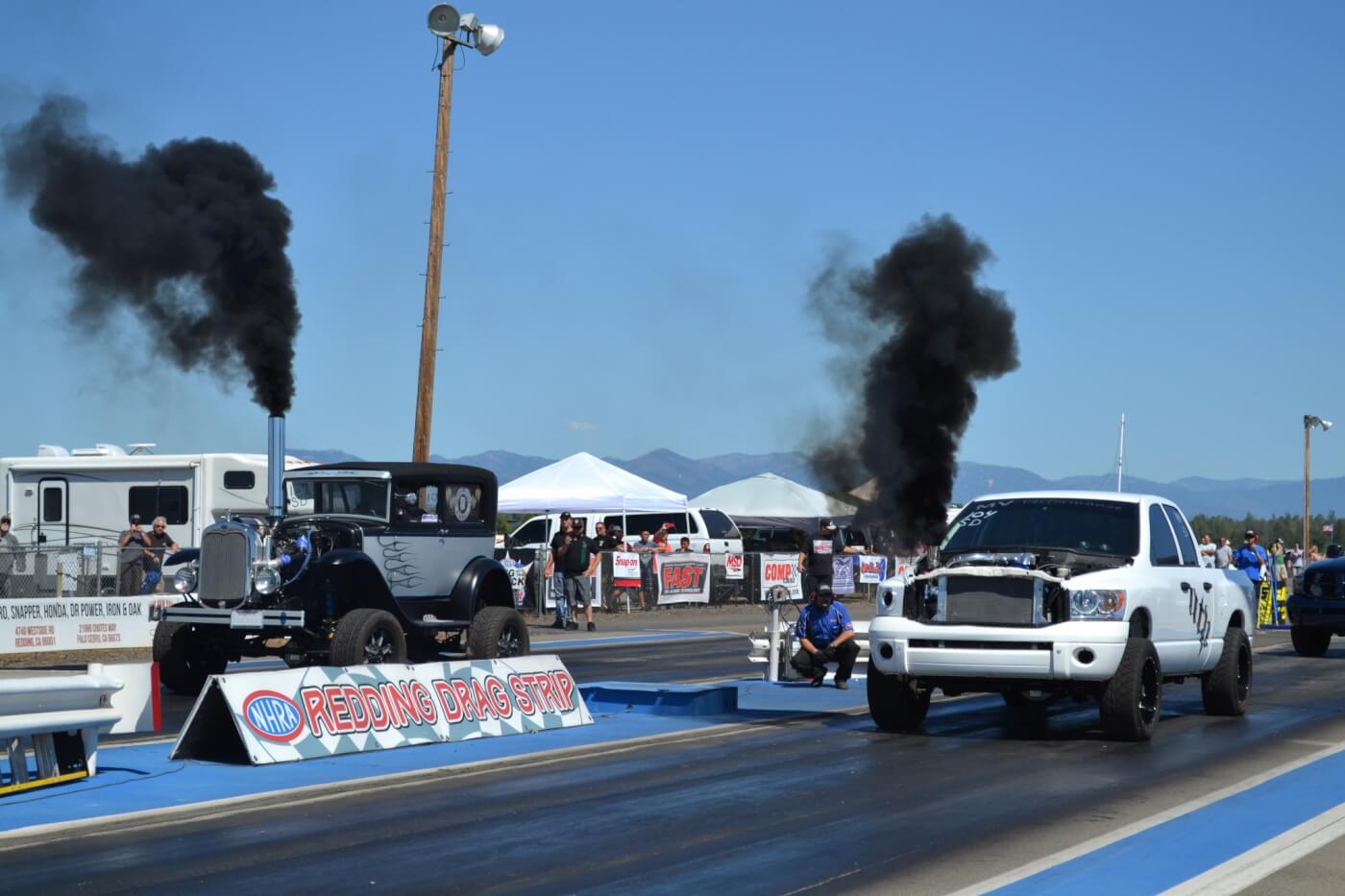 As the competition went on, we saw a number of interesting pairings, like this diesel street rod (known as “The Fodge") that lined up against a common-rail drag truck.