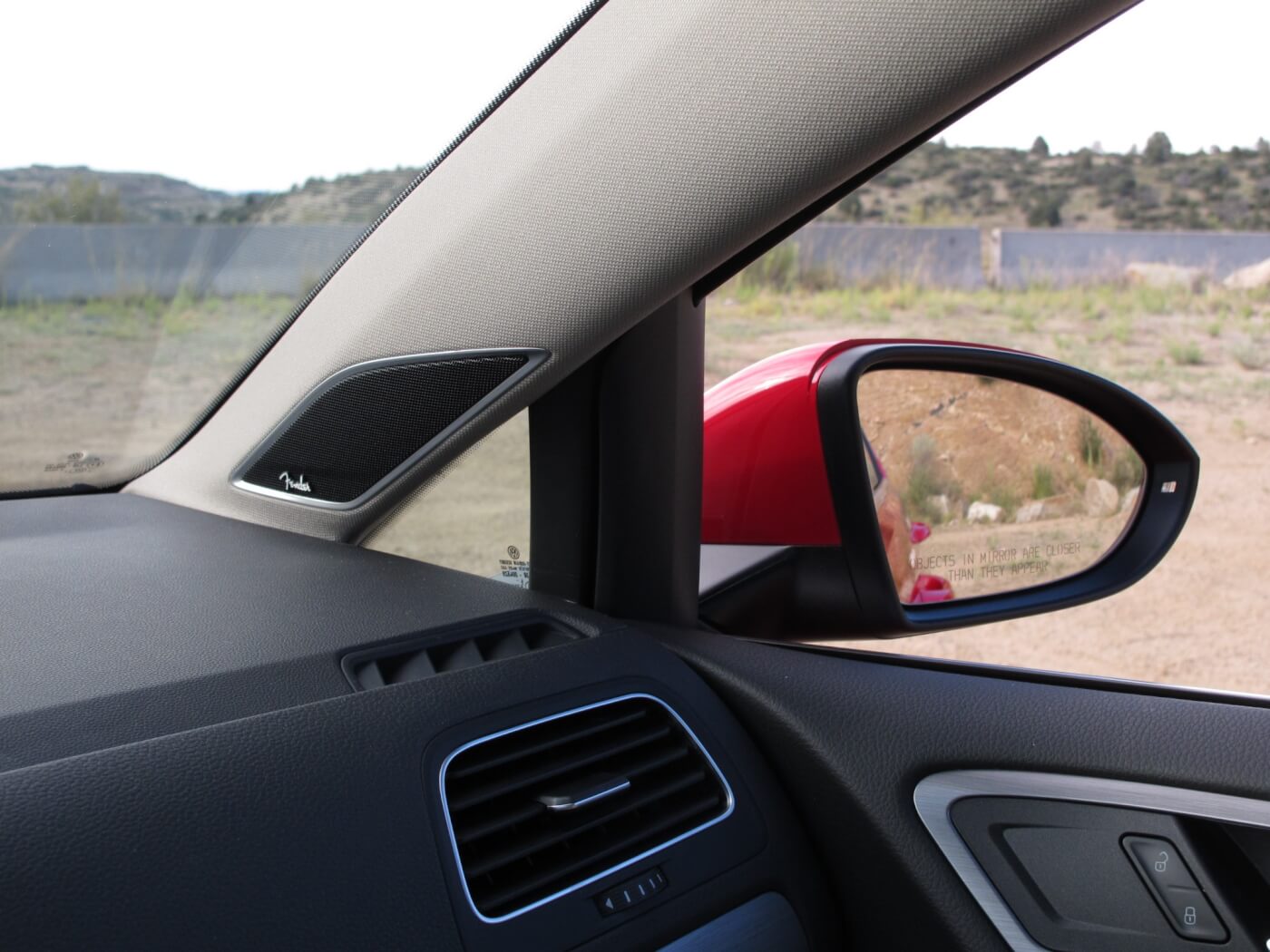 The 2015 Golf Sportwagen has an odd triangular window right over the dash at the A-pillar. This helps see what would be hiding in a blind spot if the glass weren’t there. In addition, we found it a great place to store your sunglasses. 
