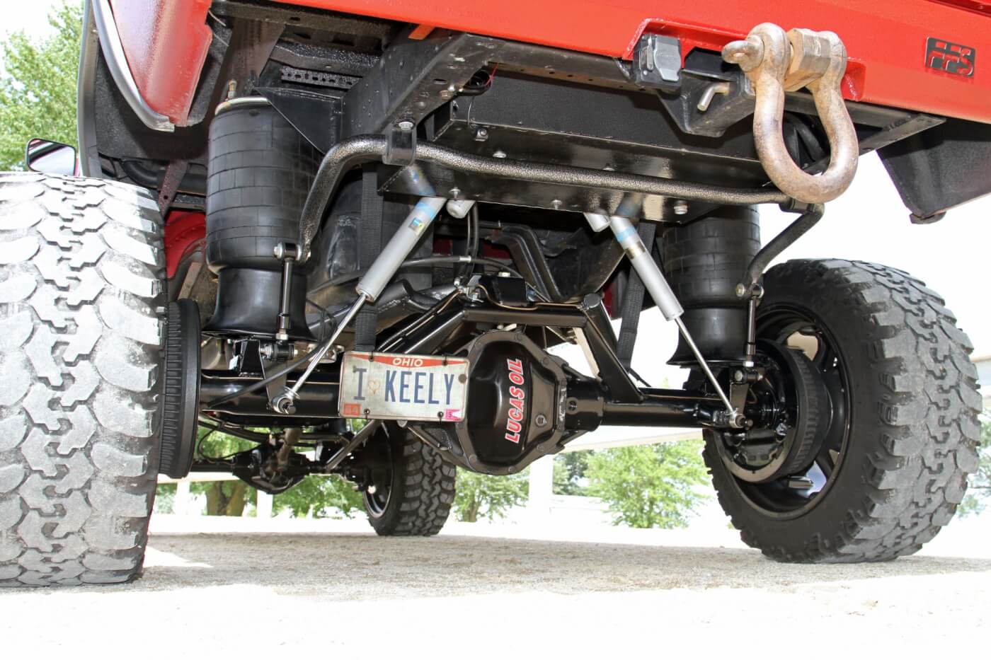 Looking under the rear of Reese’s truck, you can see the repurposed Hellwig anti-sway bar as well as the Bilstein shocks and massive 10-inch Firestone airbags all tied in to the Dana 80 axle.