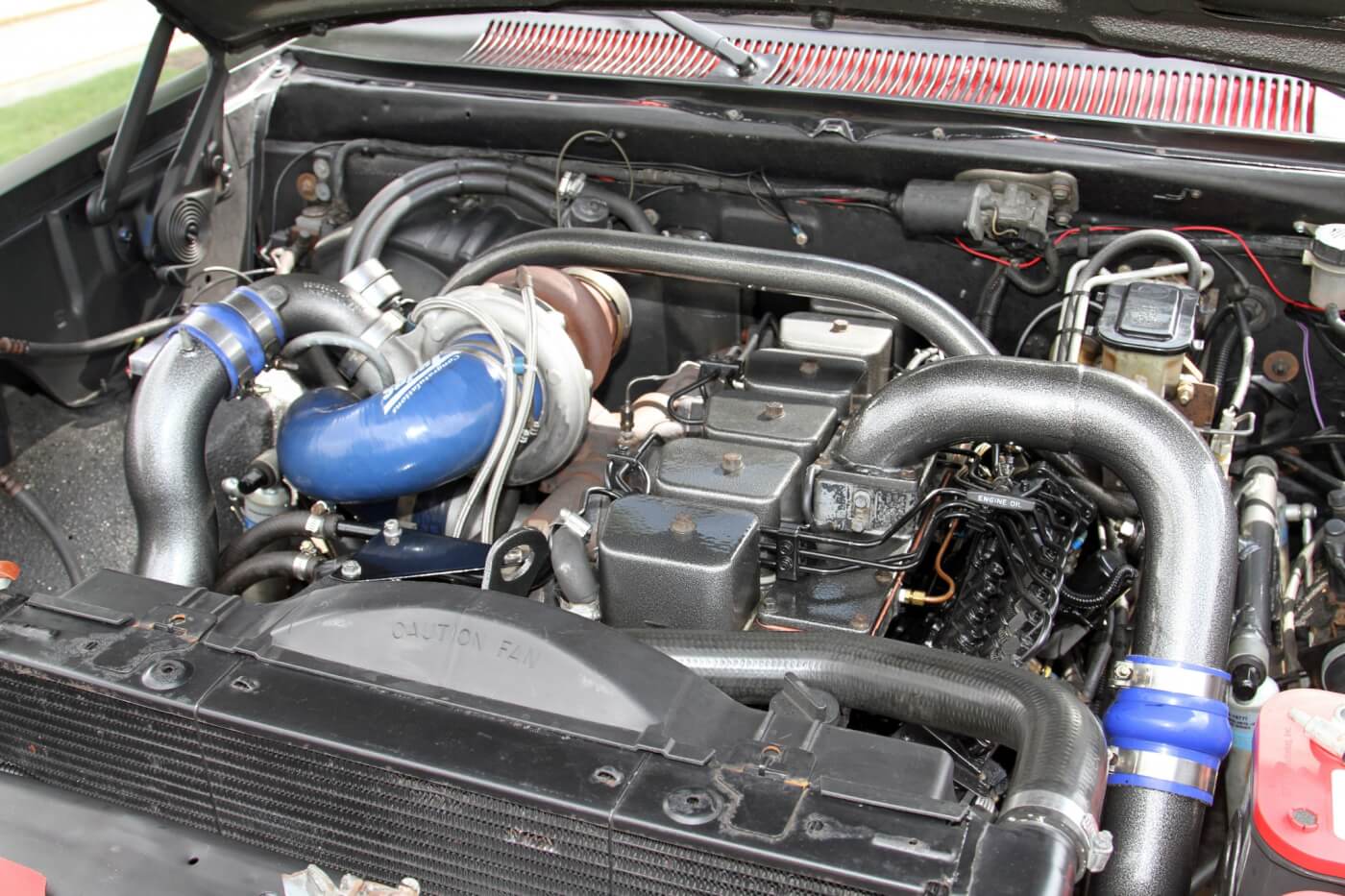 The crew cab W350s were discontinued before Dodge started using the Cummins engine, but that didn’t stop Reese from building his dream truck with a compound turbocharged Cummins 12-valve power plant.