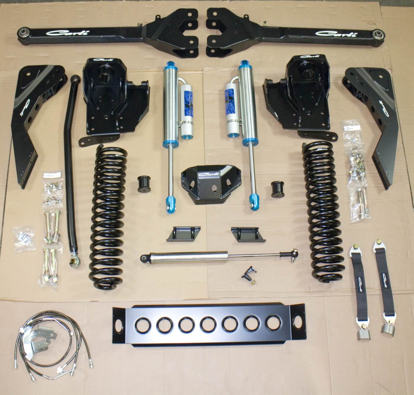 1. Here you see the front components of the Ford F-250 lift in these pages. This is the full Dominator 3.0, 4.5-inch lift setup. The front upgrade included new King remote reservoir shocks, longer springs, new front coils, coil buckets and much more. 