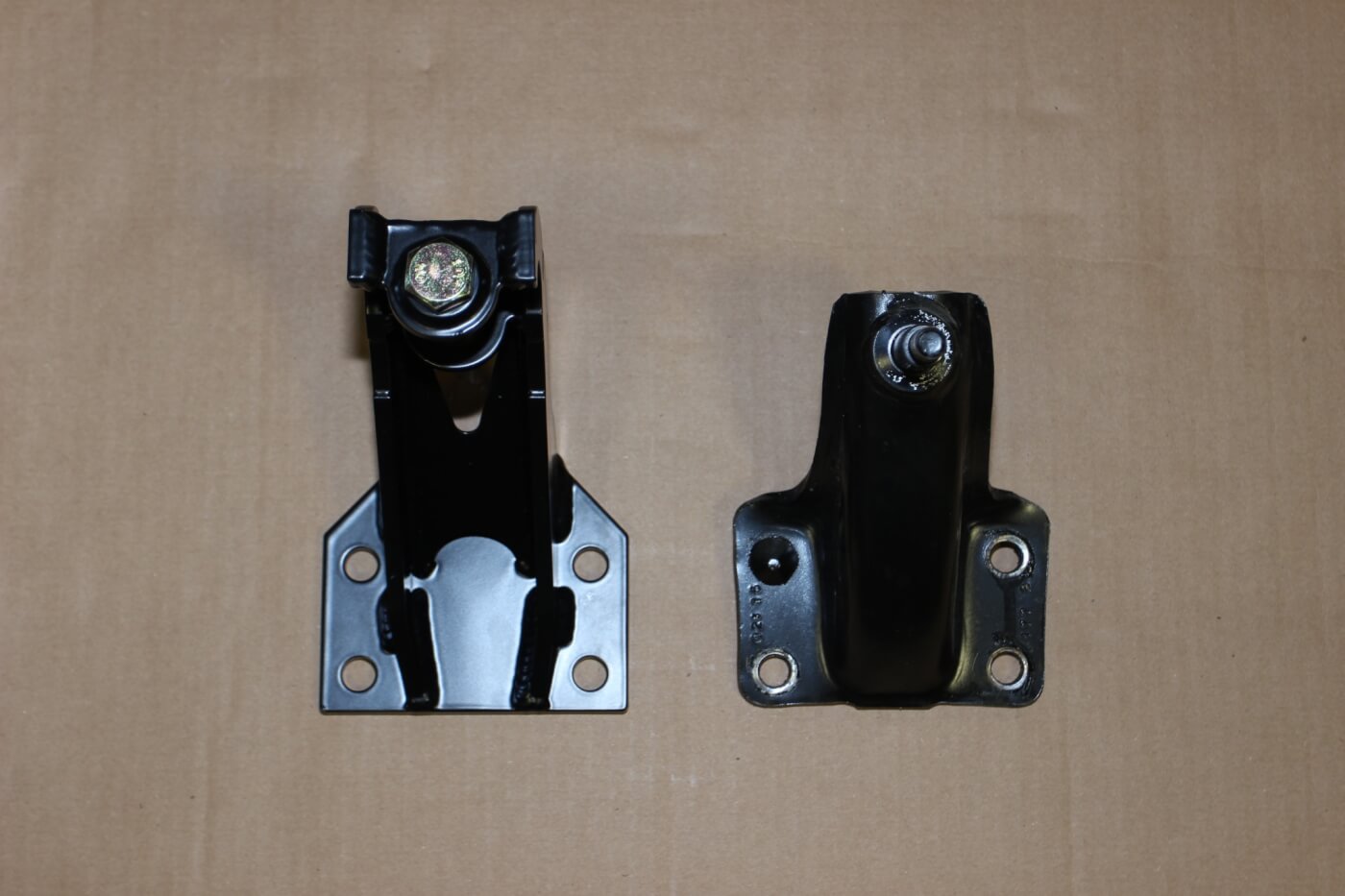 13. Here you see the new Carli rear shock mount (L) compared to the OEM mount. The OEM mount must be cut off the frame since it is riveted.