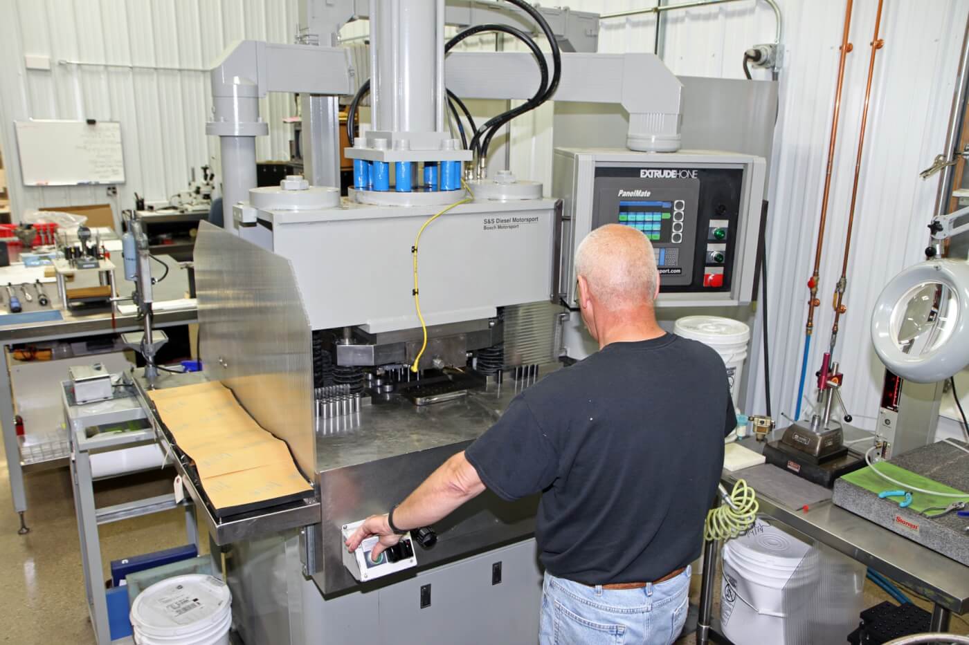 10. Greg Spoolstra operates the AFM machine to show us the process S&S nozzles go through.