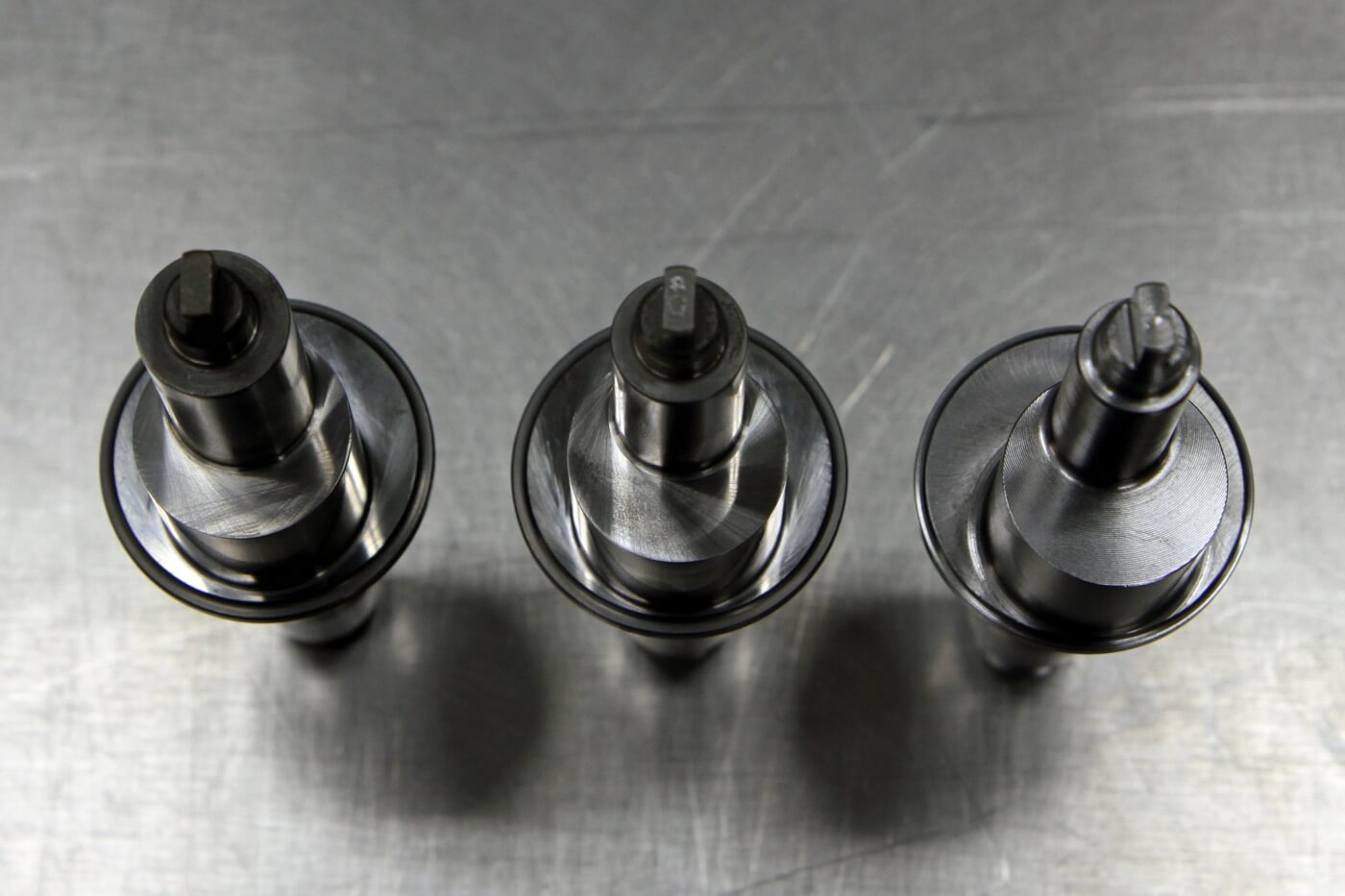 16. Here are three of the custom pump shafts S&S uses for its “Stroker” pumps. Notice that the base circle of the cam has a larger stroke as you move from the shaft on the left to the larger ones in the center and on the right. These are the 10mm, 12mm and 14mm shafts (from left to right) used in their high performance CP3 pumps.