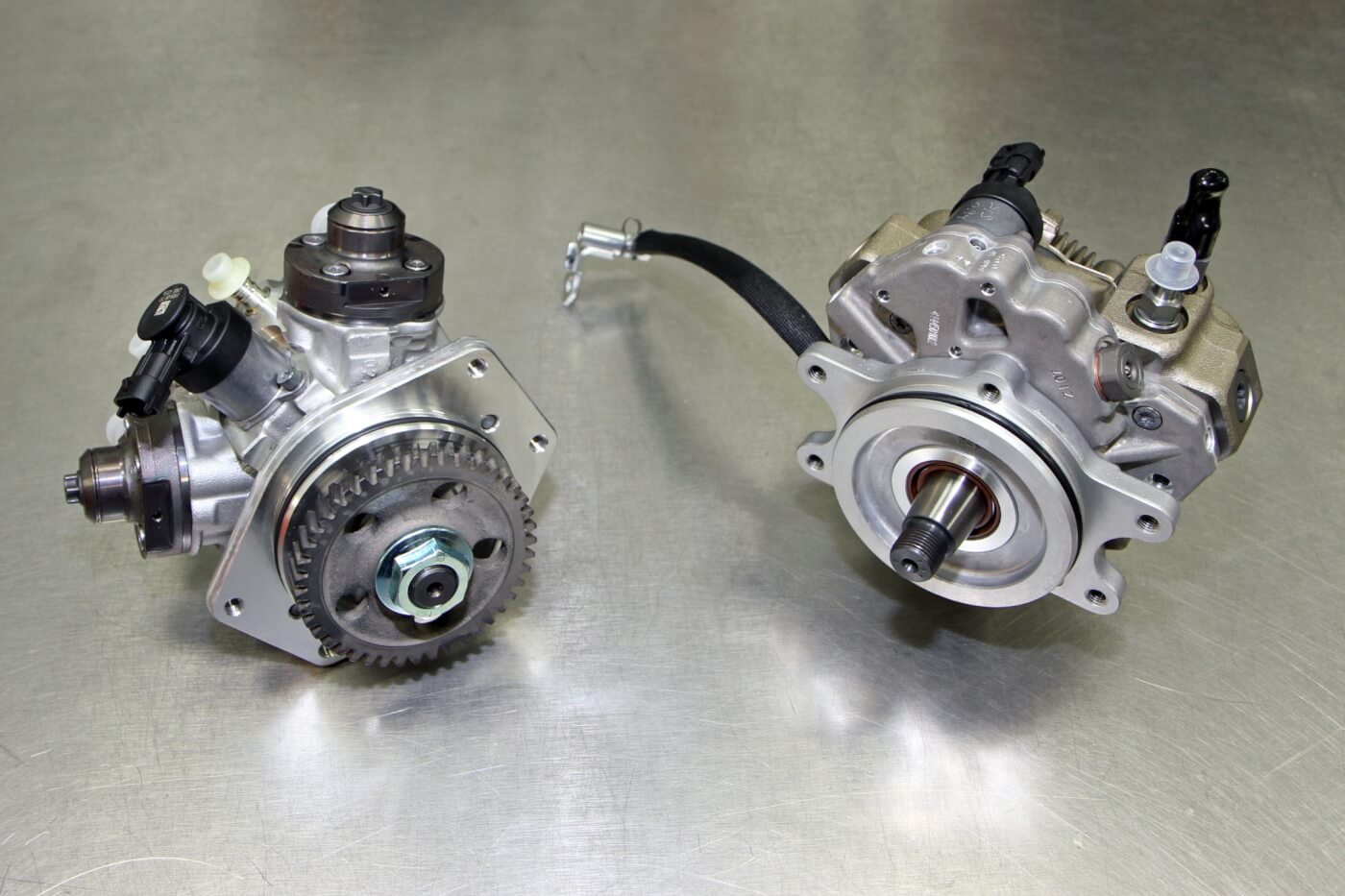 18. A stock CP4 is shown on the left with the S&S replacement CP3 unit shown on the right. The CP4 to CP3 upgrade kit for the Duramax engine will even work with the ninth injector for emissions compliance, while replacing the troublesome CP4 with the more reliable CP3.