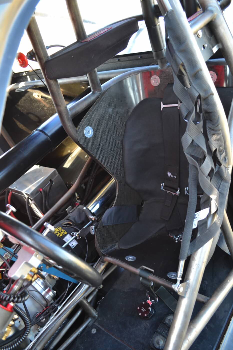 A race weight of 2,850 lbs. doesn't come easy, and weight is cut wherever possible. Even the seat is a half-seat, and it's made out of carbon fiber. 