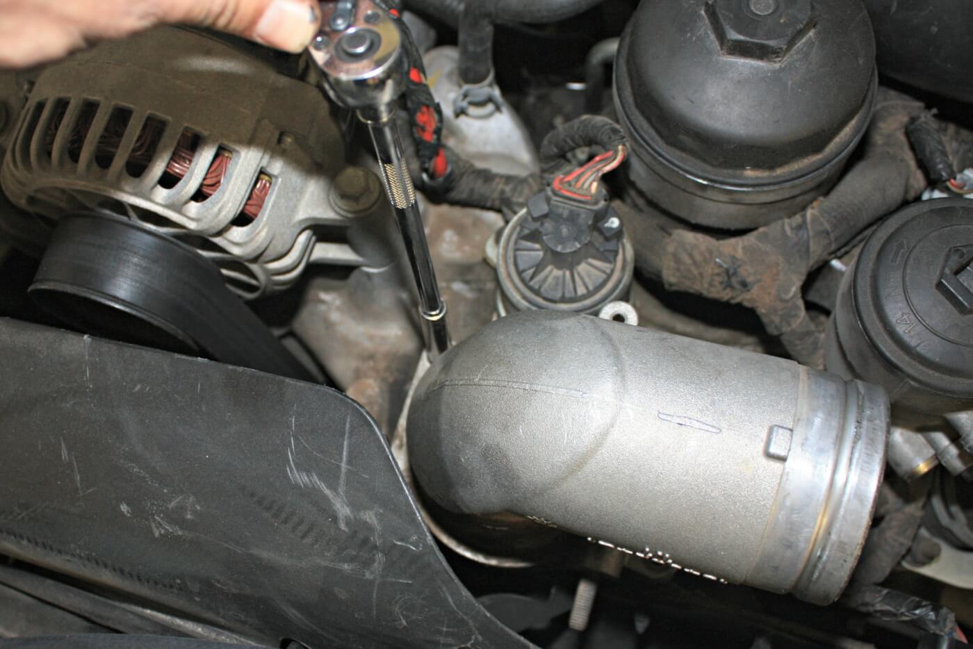 9. The factory intake elbow is then removed to make way for the better flowing High Ram Elbow. The sharp tight bends inside the stock elbow aren’t conducive to good flow and upgrading can offer both better throttle response and improved mileage.