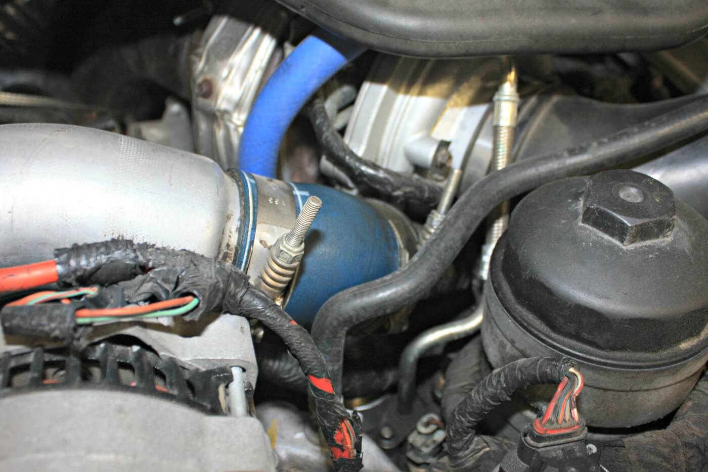 6. The passenger side (hot side) intercooler pipe connects directly to the turbocharger with this small 45-degree boot. This boot is prone to cracking and leaking, at which we were surprised to find hadn’t yet happened to this 135,000 mile truck.