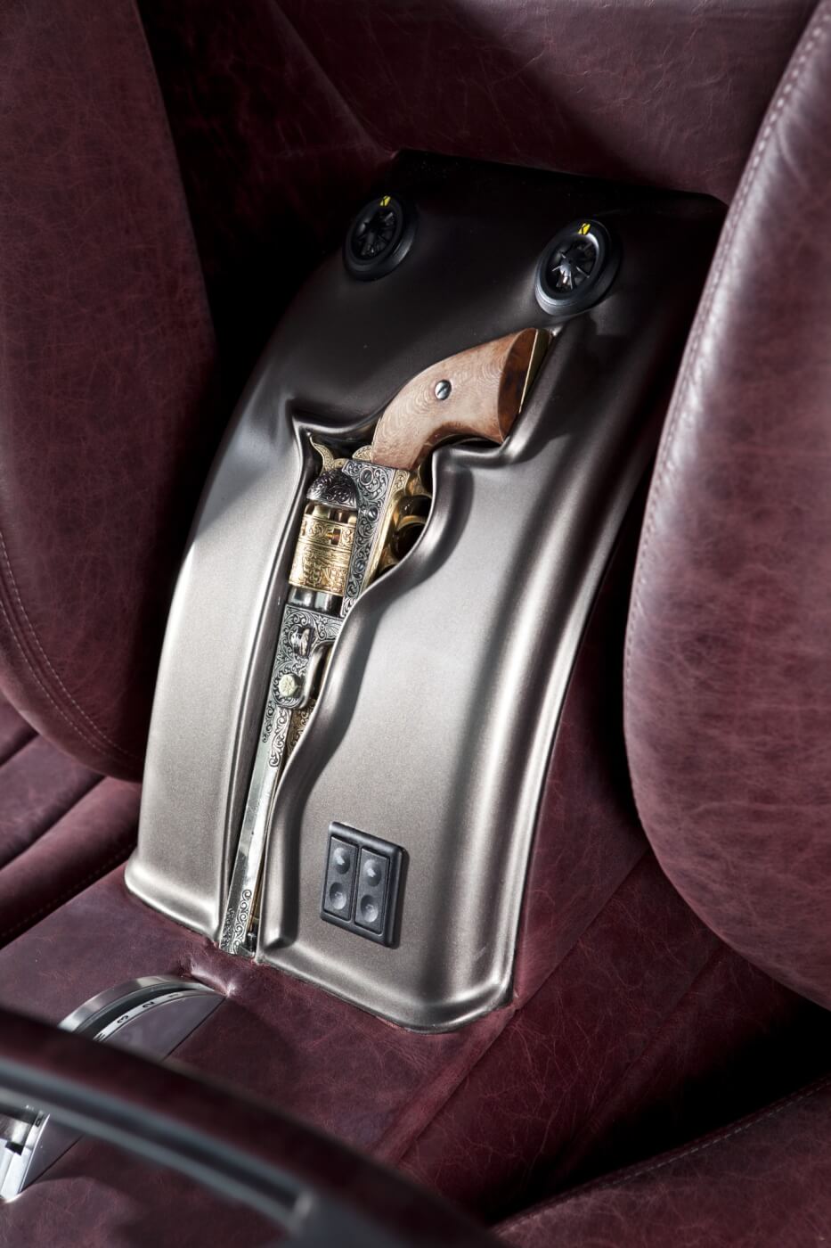 The custom center console, seen here, is fitted with an antique 1845 Colt revolver.