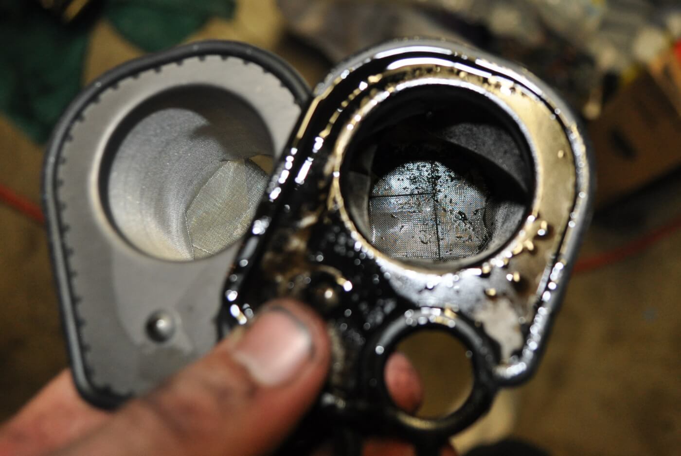 9/10. This is the HPOP oil reservoir (left). Between it and the front cover is a screen filter (right) which stops any large contaminants from entering the HPOP, and later the injectors. DieselSite includes a new filter with the Adrenaline, so of course, we replaced ours.