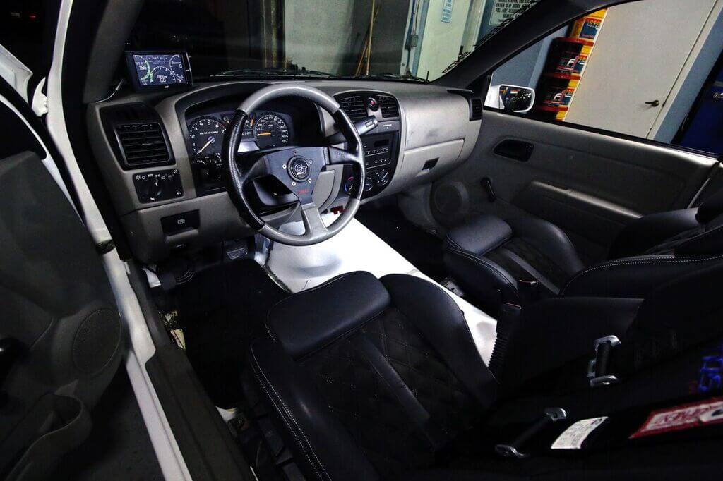 The interior is mainly stock outside a few modifications. the transmission tunnel was redone to give room for the new Allison 1000. A GT steering wheel was installed, as was an Edge CTS to monitor engine vitals.