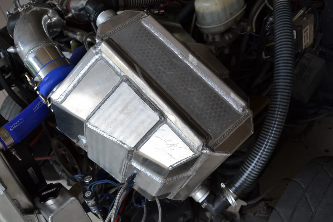 With the front clip removed, one of the more impressive engine pieces is the mammoth water-to-air intercooler. Built by Chiseled Performance, this intercooler is rated to flow up to 3,000 hp worth of air.