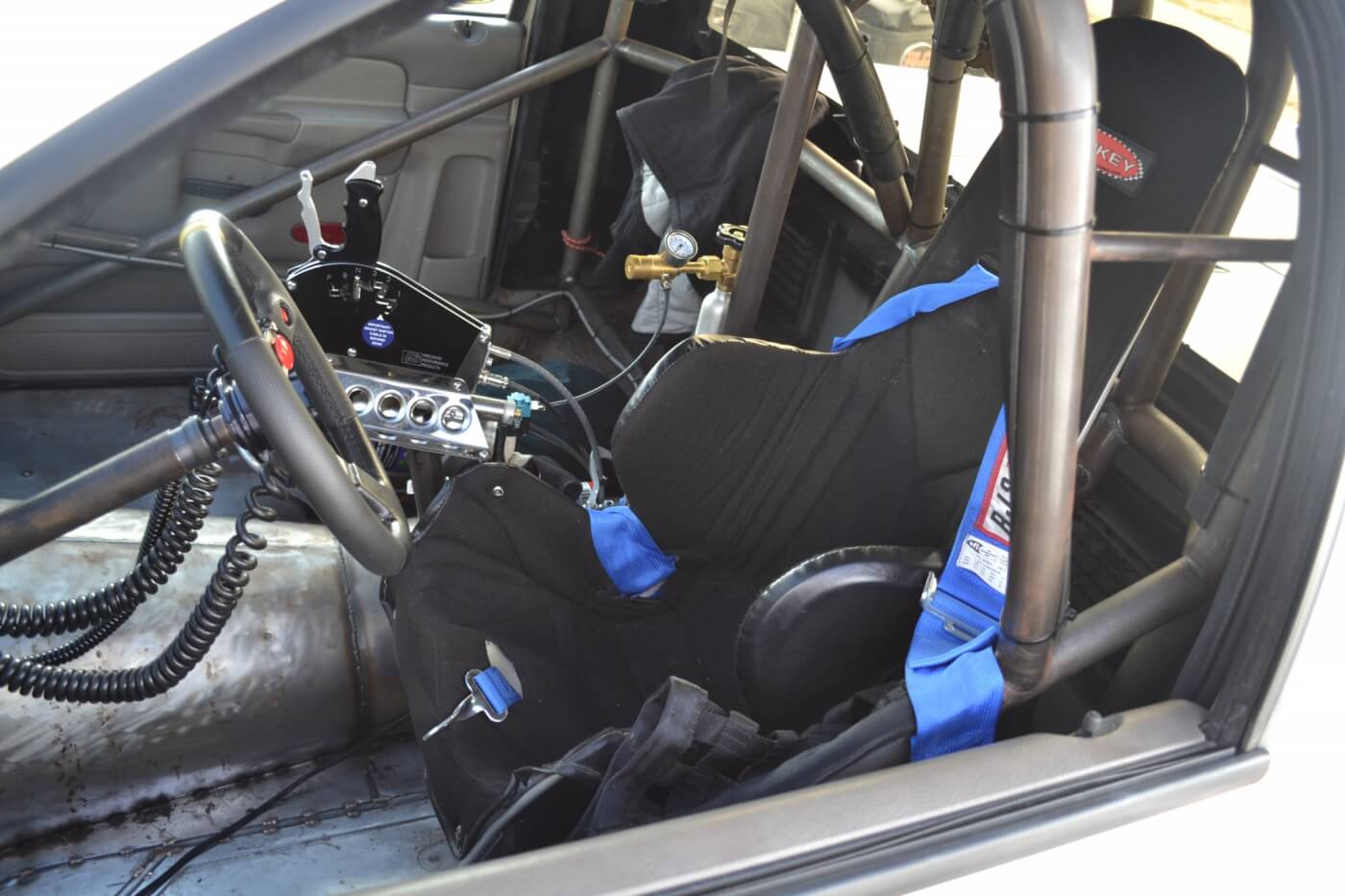 The interior of Ben's ride is a no-frills affair, with a Greg Risk-built chromoly rollcage, Kirkey racing bucket, Precision shifter, tubular steering column, and a unique dash using a Windows Tablet from FPE.