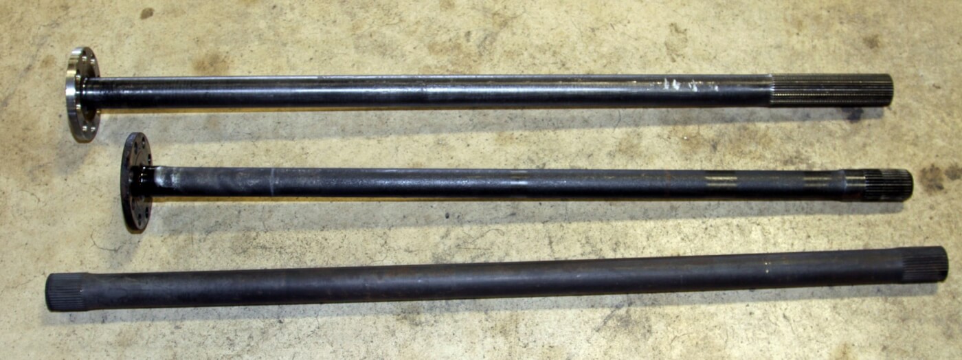 7. Comparing the factory axle (center) to the Yukon chromoly axle (top) and Branik Motorsports 300M axle (bottom) it’s easy to see that the 38-spline Yukon and Branik axles are both larger and stronger than the skinny factory shaft.