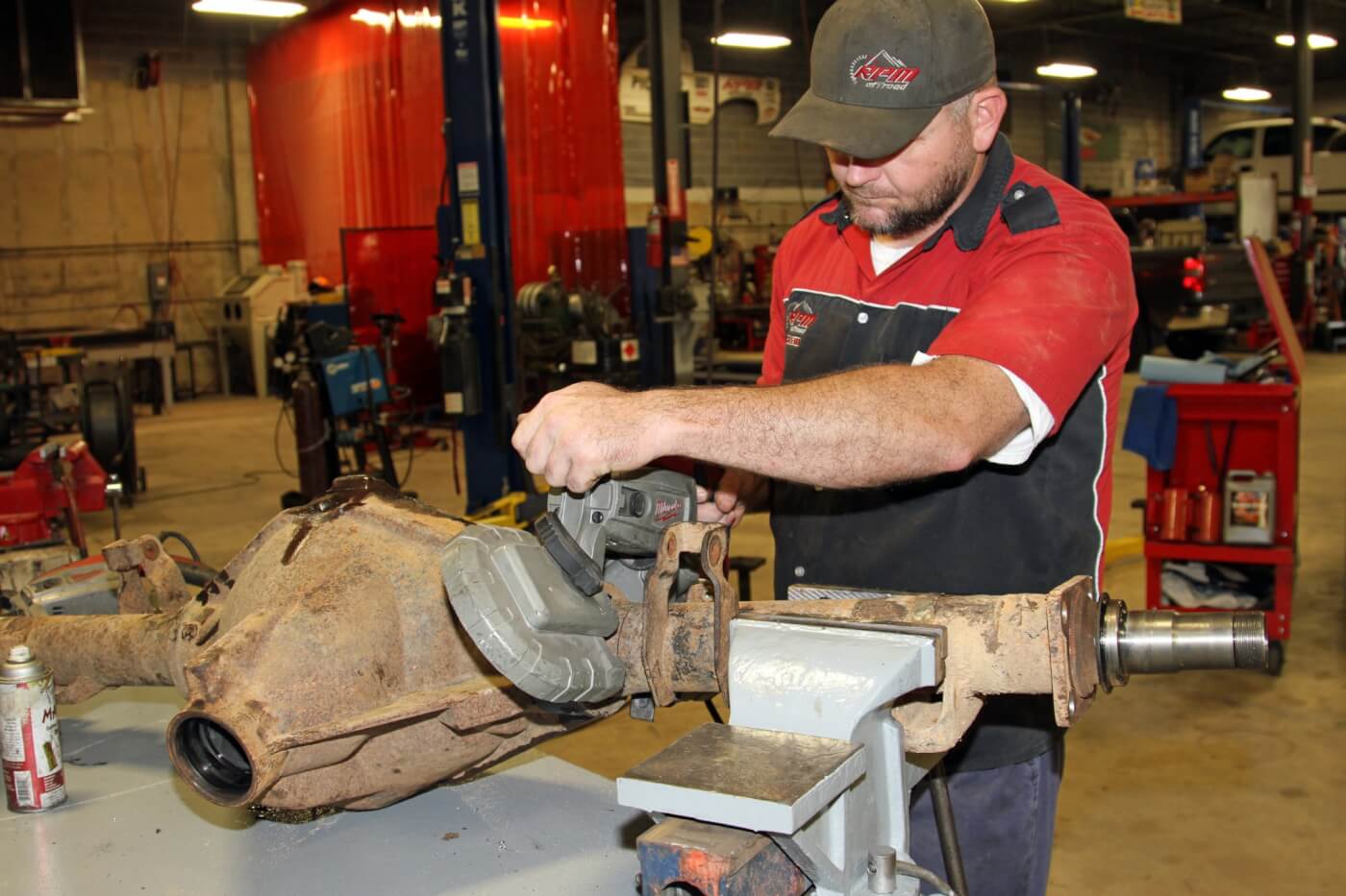 11. After taking careful measurements to determine the leaf spring pad location as well as the precise axle tube length Nelson uses a portable band saw to cut the axle tubes. The saw makes quick work of the 1/4-inch thin wall tubing.