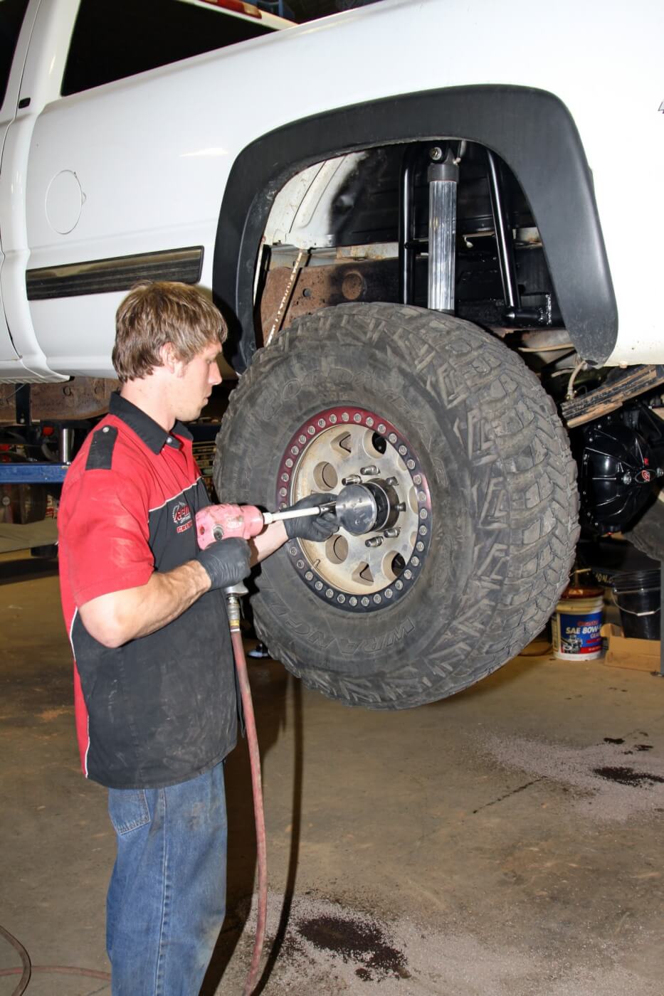 35. After the rear axle was completely assembled and the brakes were bled it was time to put the wheels back on the truck. Notice that the additional 3 inches of axle width on each side allows room for the large diameter Pure Performance shocks to fit between the frame and the tire without rubbing.