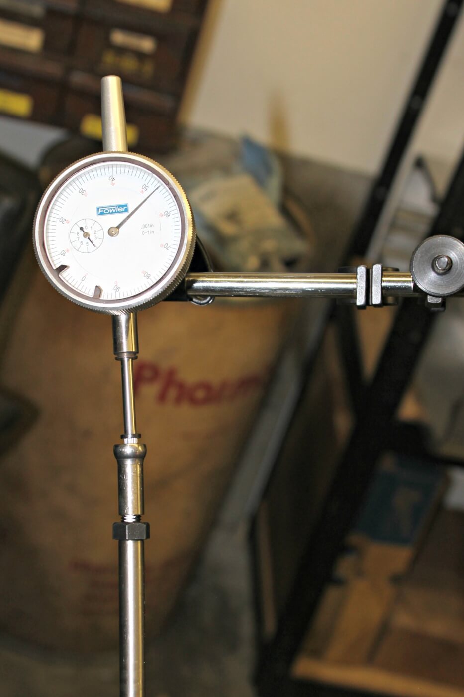 11. Once the degree wheel and pointer location have been checked, a lifter and pushrod can be dropped down into the #1 cylinder and a dial indicator setup to measure lifter travel. By rotating the engine a few times, the cam degree process will start when the lifter is on the “heel” or the cam base circle, which is the lowest point in its travel. The dial indicator should then be zeroed here.