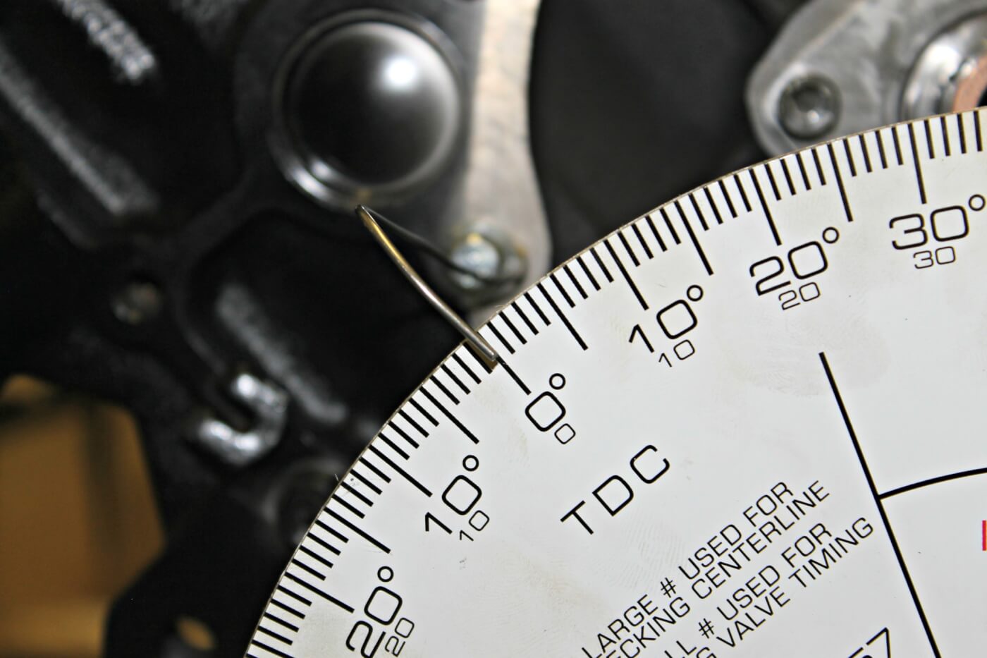 7/8. Using a small wire attached to the engine block, once true TDC is found, the timing wheel can be set at zero according to the pointer. The engine builder then rotates the engine clockwise until the #1 piston again reaches TDC. A mark is then made on the degree wheel where the pointer shows its current location. The crankshaft should then be turned clockwise until #1 TDC is reached again. If the degree wheel was setup properly, the first recorded timing mark and the second should be equal.