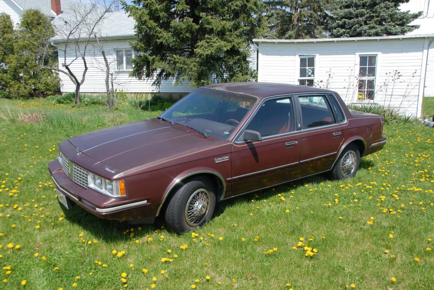 The Dark Maple Red Metallic paint may be fading but you can still see the lovely lines that made the Cutlass Ciera Oldsmobile’s best selling car for 14 years. This one was built in March of 1983 and sold to the Verhoff family by Jack Howell Chevrolet-Oldsmobile in Ottawa, Ohio, for the princely sum of $10,818. Base price for the LS Sedan was $8,892. Add to that the 4.3L diesel ($500), four-season air conditioning ($725), body side moldings ($55), accent stripe ($42), rocker panel moldings ($56), 14-inch radial tire upgrade ($36.60) and block heater ($42). There was a credit of $56 for a radio delete.