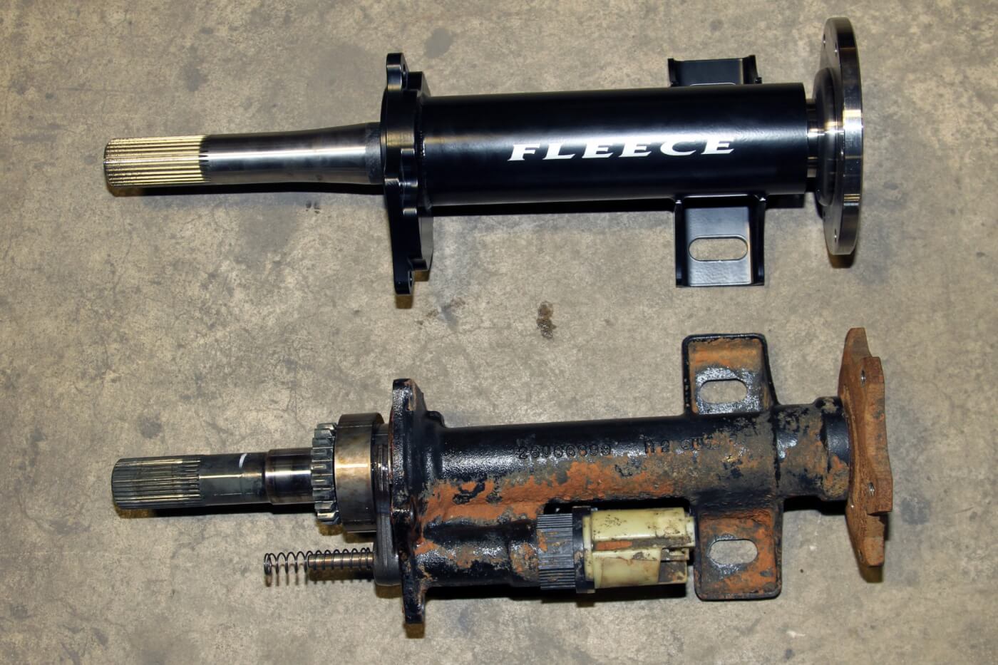 7. Compare the multi-piece factory axle assembly to the single-piece TufShaft from Fleece Performance Engineering. We installed one of the early TufShaft kits, which included a replacement housing for the axle. Their current design retains the stock housing but uses a single-piece shaft.