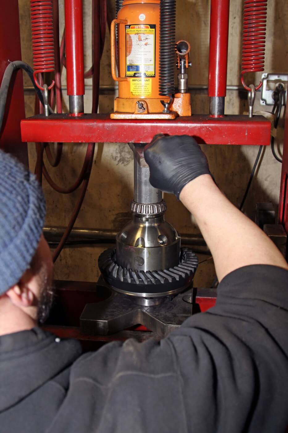 16. Nelson then uses a hydraulic press to install the new G2 bearings and the pinion gear on the locker. Important: If you do not have a press, DO NOT try to hammer on the bearings! Take the parts to a shop with a press and have them do it for you.