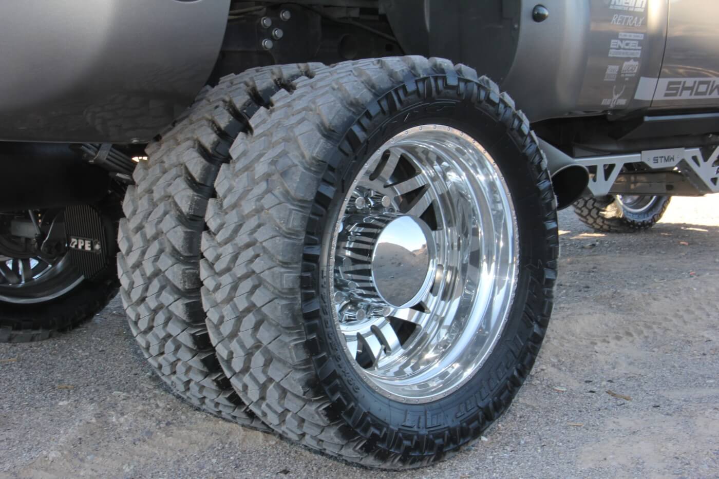 The tires of choice are Nitto Trail Grapplers, size 38x13.50R24. These are mounted on American Force 24-inch Scope wheels. Six wheels are required to roll down the road in style on this dually. 