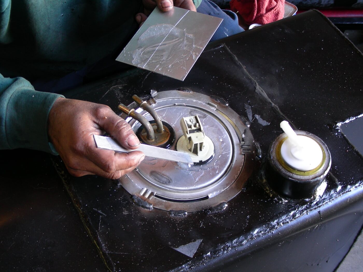 3C. Once the fuel-pickup is in place, it’s sealed with a two-part epoxy.