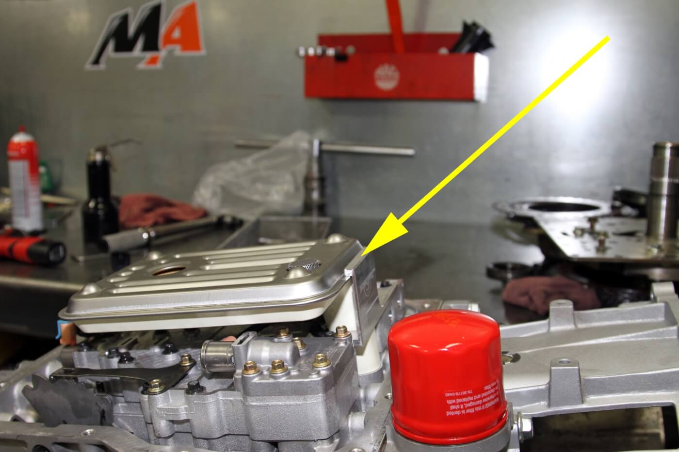 31. Since they use an Allison deep transmission pan and filter on the MA450 transmission builds, the Merchant Automotive crew also use a Sun Coast machined retainer (see arrow) to hold the filter securely in place and prevent it from falling off and causing the pump to suck air and damage the transmission.