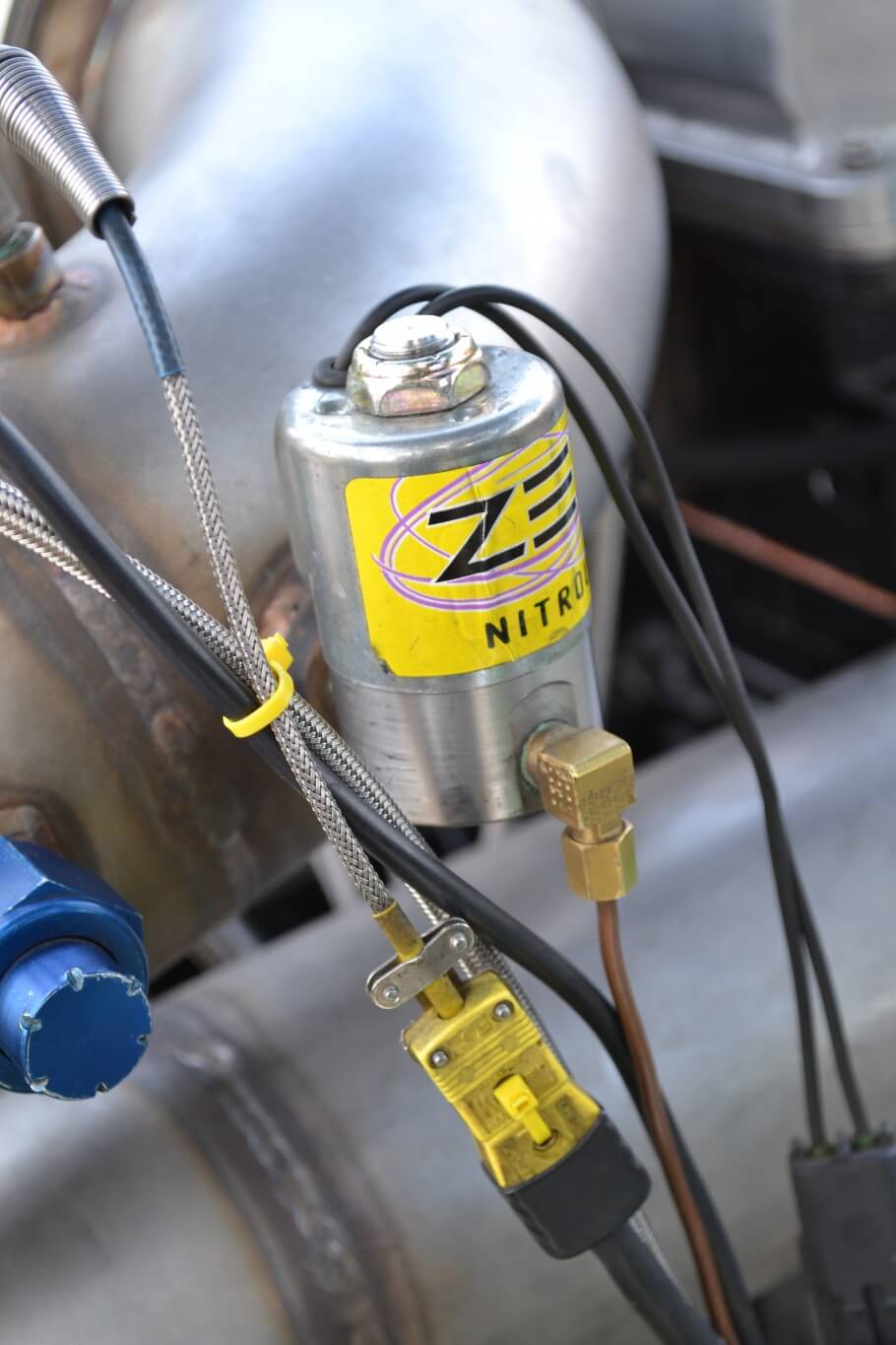 Nitrous is a big "no-no" in sled pulling, so we were surprised to see a ZEX solenoid on the engine. Turns out Matt has a sense of humor, and he actually has it connected to an ether canister, so he can fire up the 12:1 compression Cummins without assistance.
