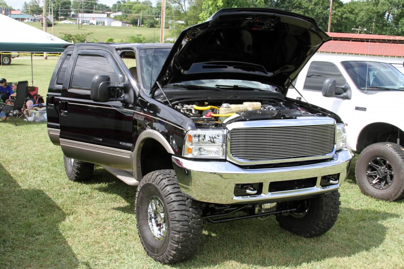 Eric Schlitzer’s lifted Ford Excursion won the award for Best Modified thanks to its clean lift and detailed engine bay.