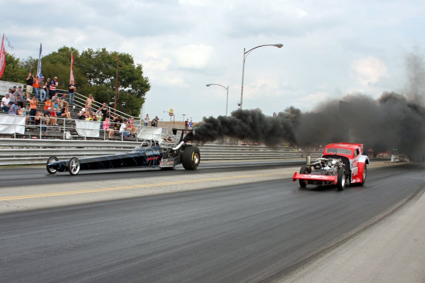 The final round of Pro Dragster Sunday was a familiar sight with John Robinson (near lane) lining up against Jarod Jones. Jones and the Scheid dragster pulled off the win with a mid 4-second pass at nearly 160 mph.