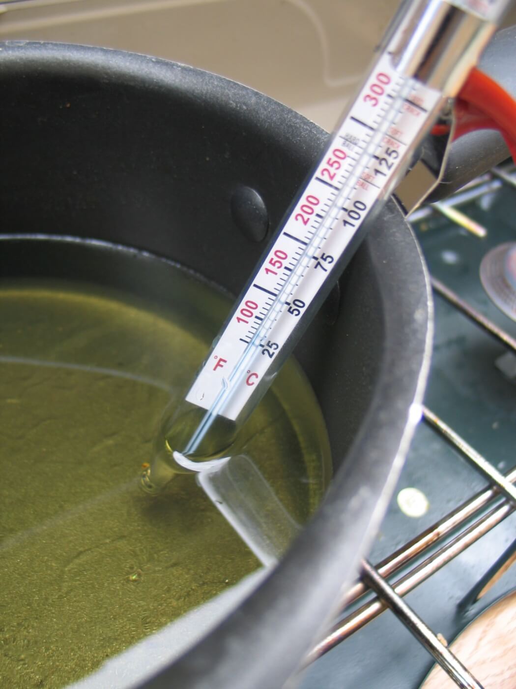 2. Using a candy thermometer is a good way to maintain proper temperature control as it can be suspended by the side of the pot so it measures the liquid and not the bottom of the pot. 