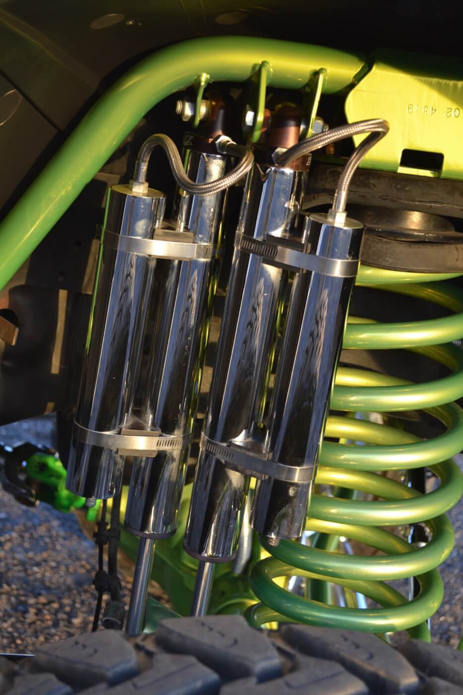 Big heavy wheels and tires require big dampening power, so part of the 10-inch lift was the installation of chrome King reservoir shocks. Two shocks per side get the job done and are hung from Shocker Yellow mounting brackets.